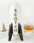 Jonathan Adler Rocket Scotch Decanter in glossy white porcelain with gold detailing, shown open with whiskey glass, available at Spacio India