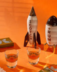 Jonathan Adler Rocket Scotch Decanter displayed alongside matching Rocket Rum Decanter, enhancing stylish bar decor, available at Spacio India