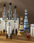 Jonathan Adler Rocket Scotch Decanter placed elegantly among a premium assortment of Jonathan Adler designer decanters, ideal for luxury bar decor, available at Spacio India