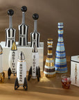 Jonathan Adler Rocket Scotch Decanter placed elegantly among a premium assortment of Jonathan Adler designer decanters, ideal for luxury bar decor, available at Spacio India