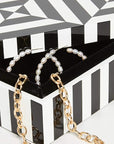 Jonathan Adler Op Art Small Black & White Box styled with jewellery inside, showing functional decor design with lacquer finish and black lining, available at Spacio India.