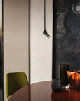 Round table with decorative items in a modern interior setting