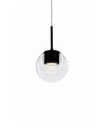 Modern pendant light with clear glass shade and black fixture on a white background by KDLN, available at Spacio in India.