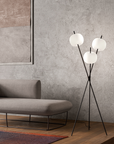 A floor lamp from KDLN standing in the corner of a Luxury Living Room styled by Spacio India Interior Styling Team