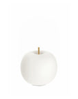 White decorative apple shaped table lamp with a gold stem on a white background
