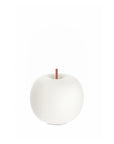White glass shaped apple table lamp with a copper stem on a white background