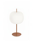 Table lamp with white shade and bronze base on a white background from KDLM available at Spacio in India