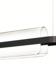 A black and white KDLN Nami Suspension pendant lamp with a black frame and diffuser.