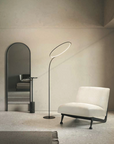 A flexible room configuration with a KDLN Poise Floor Lamp as the main light source.