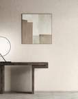 A KDLN Poise Table Lamp emits a circle of light, illuminating a painting on the wall.