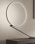 An adjustable KDLN Poise Table Lamp with a circle of light on top.