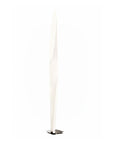 Modern floor lamp called Shakti from KDLN with a white shade on a white background available at Spacio retail stores in India.