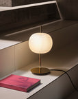 Modern table lamp with a white shade on a concrete staircase