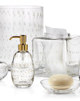 Labrazel Clear glass bathroom accessories with silver & gold accents on a white background in
