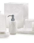 White onyx marble bathroom accessories from Labrazel including a soap dispenser, tray, and containers on a white background at Spacio retail store in Mumbai