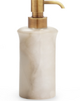 Cream soap dispenser on a white background