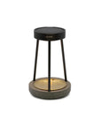 Modern outdoor solar table lamp with black metal stand and textured base on a white background
