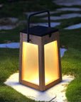 Wooden Solar lantern with a solar light on a grassy area