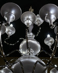 Chandelier with multiple light bulbs against a dark background