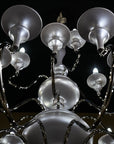 Chandelier with multiple light bulbs against a dark background