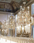 Opulent dining room with multiple Italian ceramic chandeliers and ornate decor