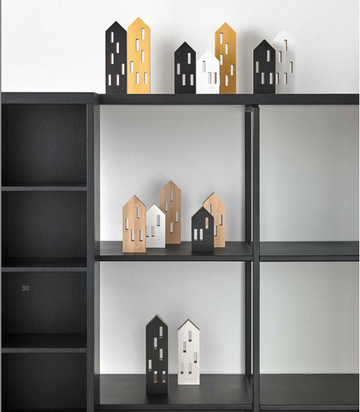 A black ML City Opening B&W (4pc set) bookcase with a collection of house figurines on it, made of beech wood, made by Madlab.