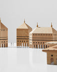A "ML Utopia Collection Octo Box" by Madlab, handmade wooden model of a mosque, is on a table.