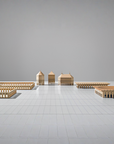 A set of ML Utopia Collection Square Box wooden buildings on a white floor, handmade with love by Madlab.
