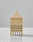 A ML Utopia Collection Square Box by Madlab, handmade out of wood, representing a mosque on a tiled floor.