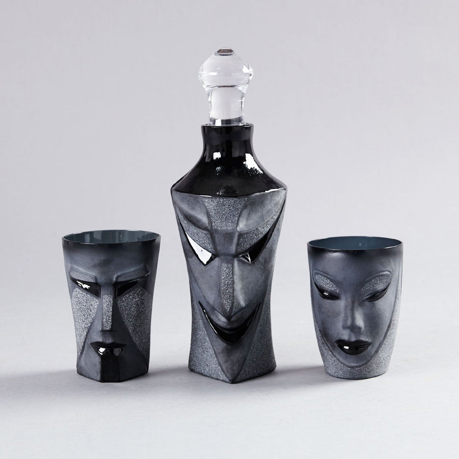 Crystal Kubik Black Tumbler with Black Lucifer decanter and Electra Tumbler on a grey back ground from Masque collection by Maleras for modern interiors available at Spacio India from the Drink ware of Bar Accessories Collection.
