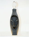 Side look of Maleras Crystal Electra Black Decanter from Masque collection with shade of yellow light on it on a white back ground for modern interiors available at Spacio India Bar Accessories Collection.