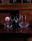 Maleras Crystal Into The Woods Vase with other crystal bar accessories on a table with in classic interior available at Spacio India from Decor Accessories Collection of Vases.