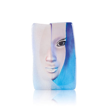 A vibrant blue and white vase with a woman's face on it, crafted in the style of Maleras Crystal Sculpture's Mazzai Blue.