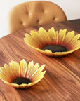 Maleras Crystal Sunflower Bowl Large Bowl with other Sunflower Small Bowl on wood dining table in dining interior room for modern homes available at Spacio India from Decor Accessories and Tableware Collection of Decorative Bowls.