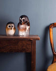 Maleras Brown Crystal Owl Swedish Glass Art displayed elegantly on wooden table – sophisticated crystal owl sculpture by Maleras, available online and at Spacio India stores.