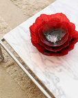 Nested arrangement of Maleras Crystal Poppy Bowls in red and black, displayed on a luxurious marble tabletop, crafted by Maleras, available at Spacio India stores and online.