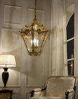 Decorative chandelier hanging above a chair in a room with a lamp and window.