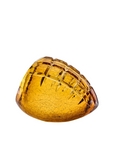 Amber-colored crystal on a white background