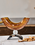 Mario Cioni Crystal Amber Bowl with Black base on a a wooden table available at Spacio India for luxury home decor accessories collection of Bowls & Centerpieces.