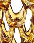 A close up of a Mario Cioni Crystal Arabesque Vase Amber yellow glass vase.
