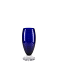 Blue crystal glass vase with textured design on a white background