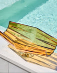 Amber finished crystal centre pieces on a poolside ledge