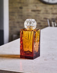 The IO Love Amber clear Vase by Mario Cioni on a marble background