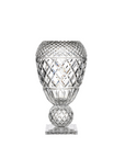 Clear glass vase with diamond cut pattern on a white background