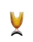 Decorative crystal vase with geometric design on a white background