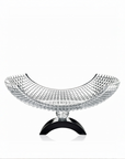Decorative crystal bowl centrepiece with a black base on a white background