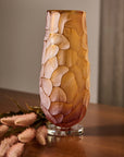 Decorative crystal vase with stone-like pattern on a wooden surface