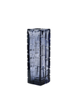 Tall, dark blue crystal vase with textured pattern on a white background