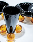 Mario Cioni Crystal Acrobat Black Vase with Amber Spheres by Tondo Doni with Acrobat Bowl & Centerpiece on a table available at Spacio India for luxury home decor accessories collection of decorative Vases.