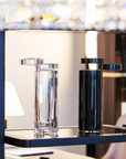 Mario Cioni A.Y.L.I. Cilindric Black Crystal Vase by Tondo Doni with Black vase on a book shelf in modern interior available at spacio india for luxury home decor collection of decorative vases.
